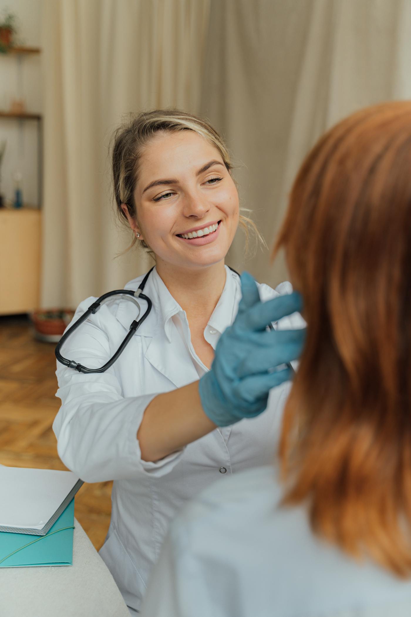 A clinician and patient sharing a warm, genuine moment of connection
